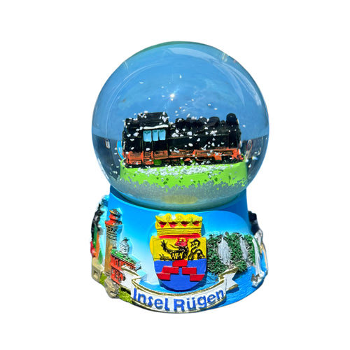 1.	Vorderansicht:
Schneekugel mit Dampflok Rasender Roland – bunter Sockel mit Rügen-Motiven wie Kreideküste, Seebrücke Sellin und Wappen der Insel